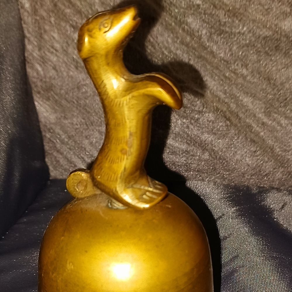 Brass bell with dog as handle